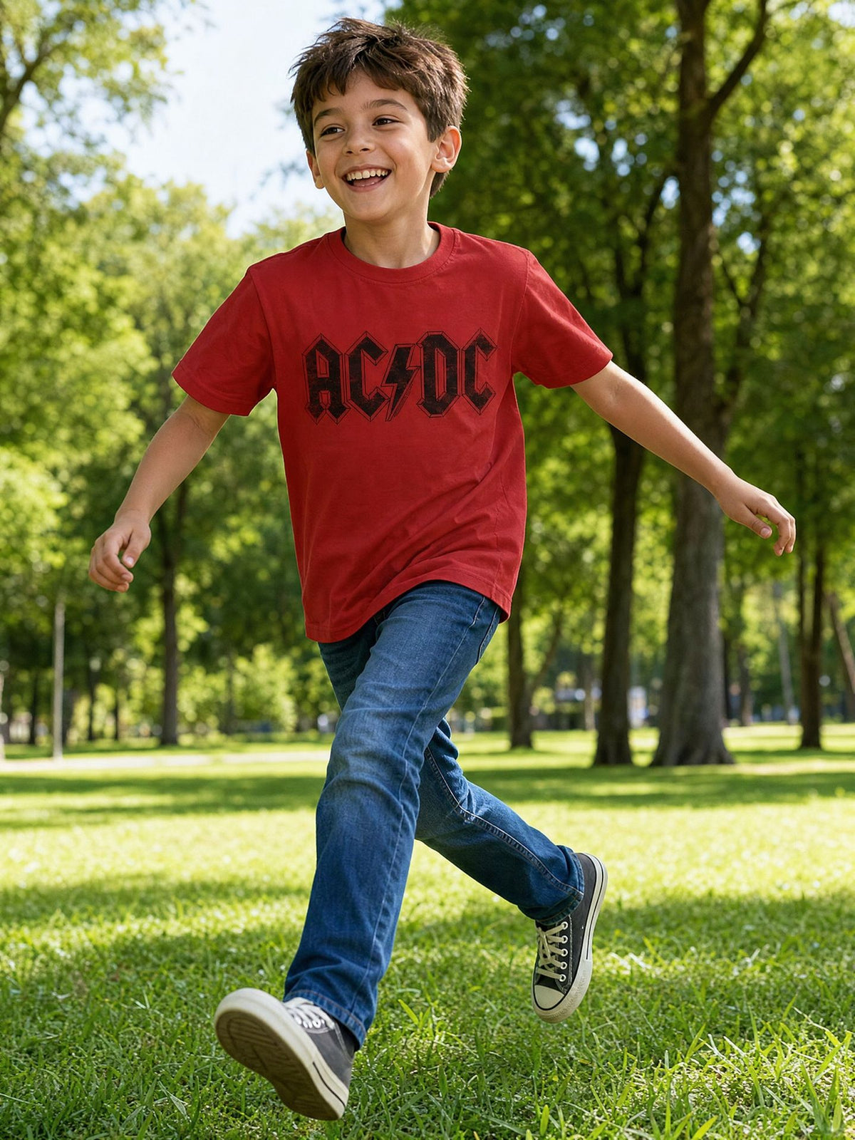 Boy wearing the officially licensed AC/DC logo youth T-shirt in a park. AI-generated lifestyle image.